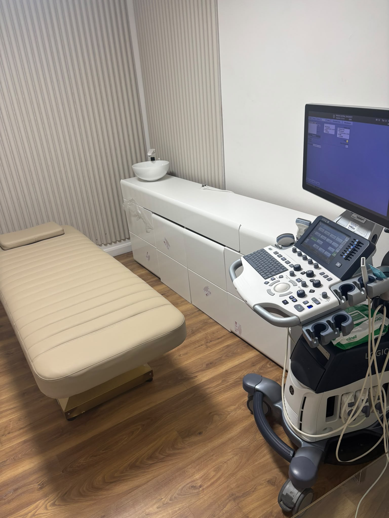 Doctor examining a patient's skin during a professional dermatology consultation at Drskin Central Diagnostics