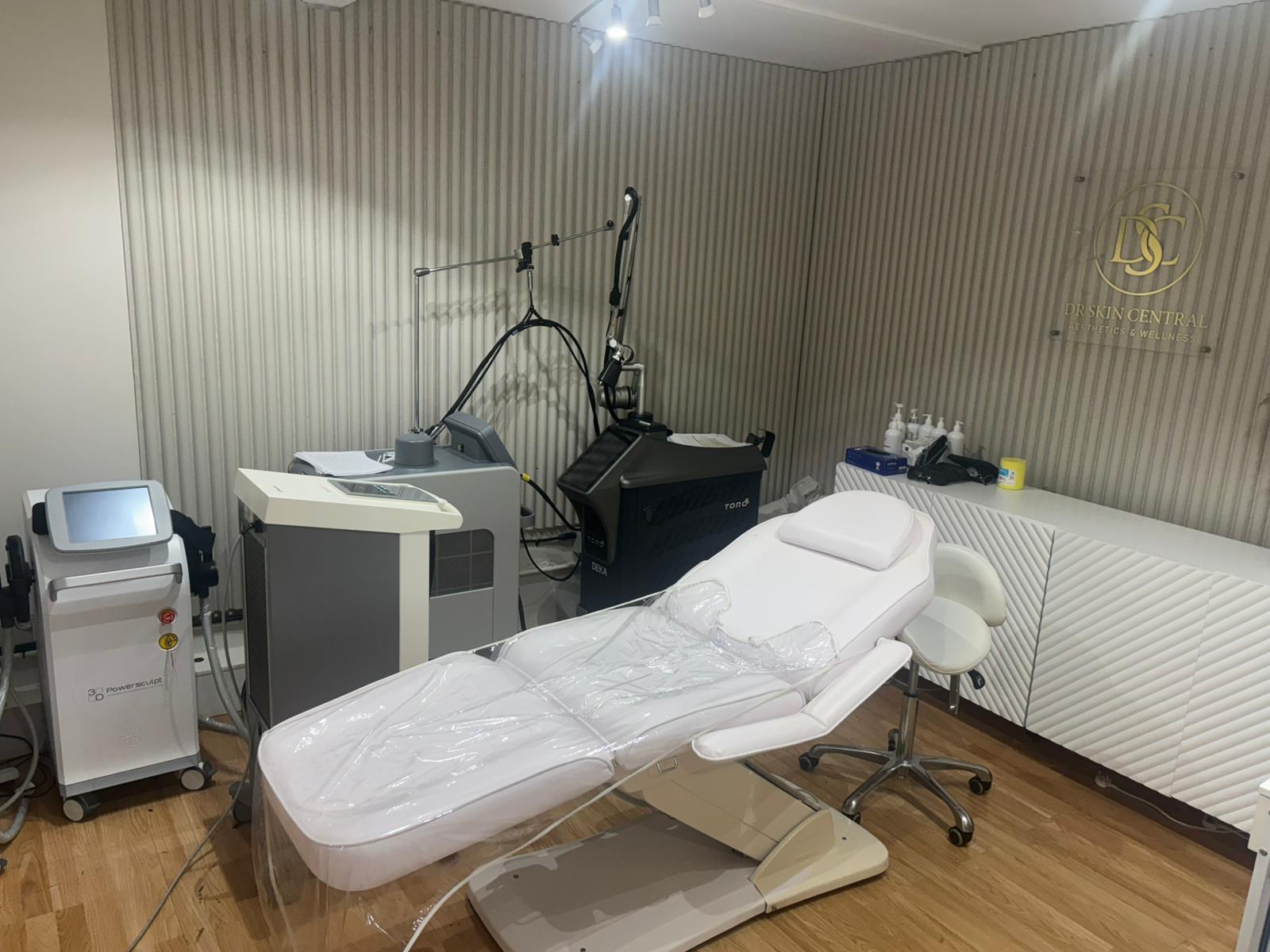 Doctor examining a patient's skin during a professional dermatology consultation at Drskin Central Diagnostics